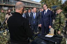 President Vučić and King Mswati III inspect the display of a part of arms and military equipment