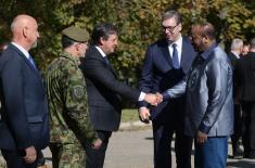 President Vučić and King Mswati III inspect the display of a part of arms and military equipment